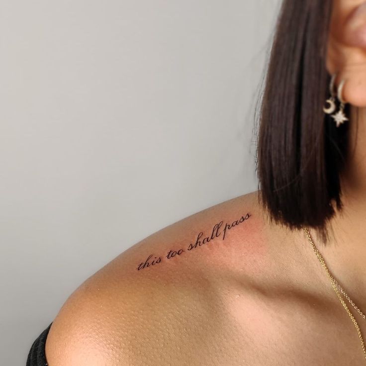 a woman with a tattoo on her shoulder