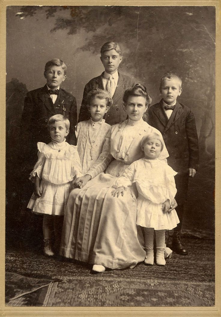 an old black and white photo of a family