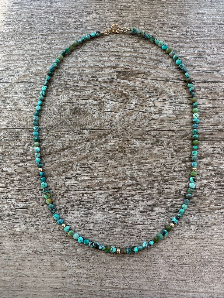 This elegant and stylish Turquoise and Gold Layer Necklace is made with natural turquoise and gold filled beads and clasp. The combination of these high-quality materials adds a touch of luxury to the necklace. Turquoise is known for its calming and protective properties, making this necklace both beautiful and beneficial for the wearer. Elevate any outfit with this unique and sophisticated piece. 16 inches long.