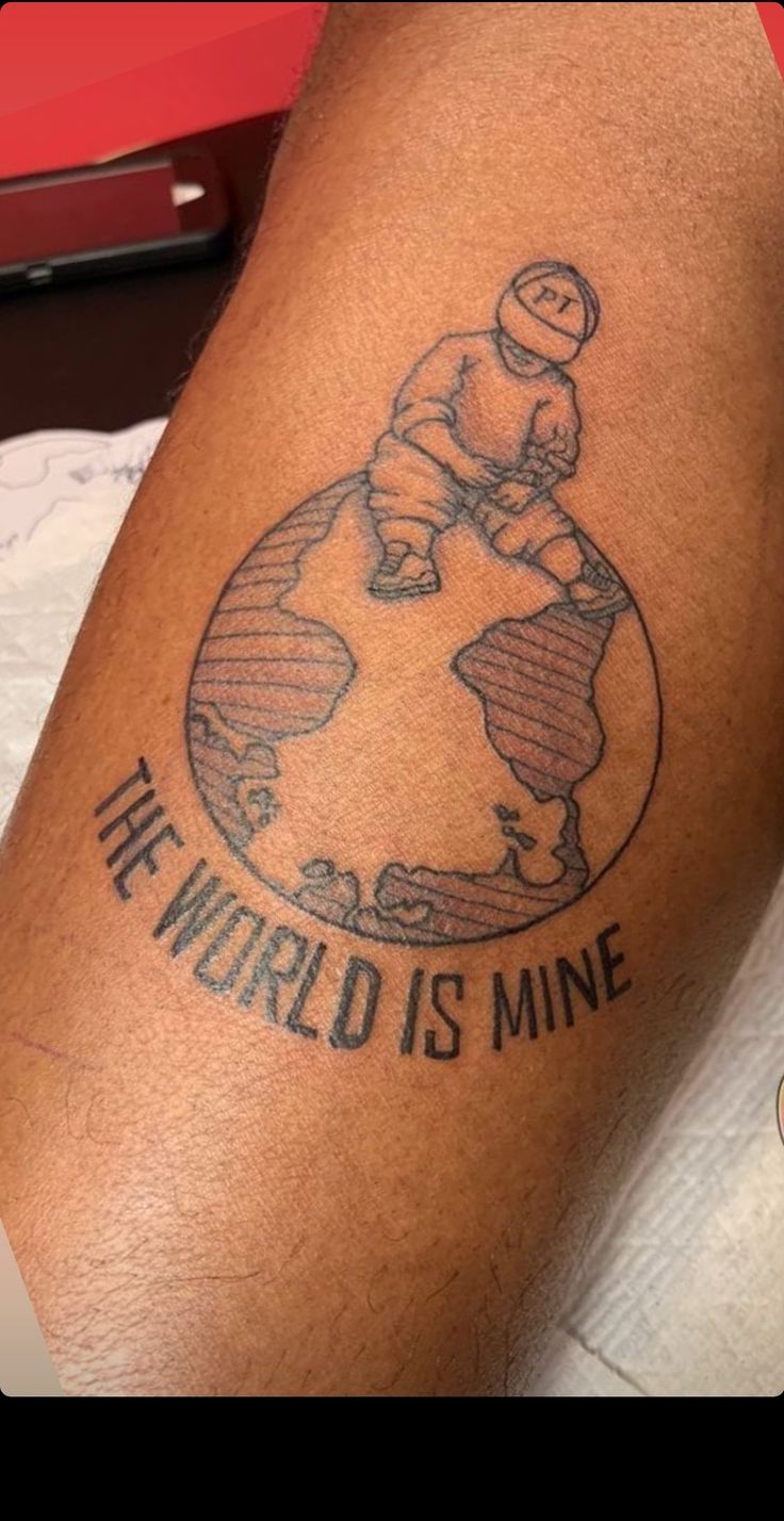 the world is mine tattoo on someone's leg