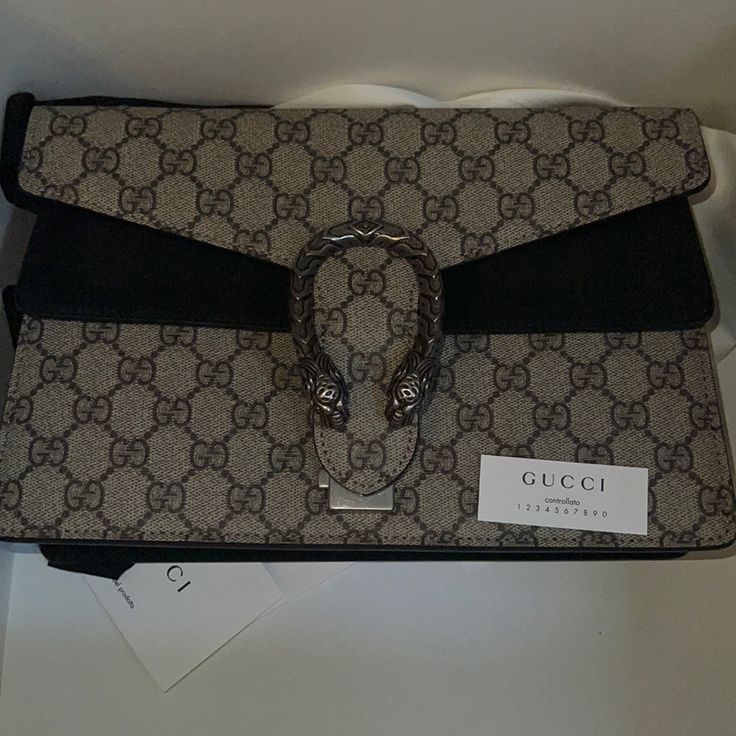 New Flap Medium Gucci Bag Perfect For Work Or Traveling Designer Gucci Bag With Branded Hardware, Designer Gucci Shoulder Bag With Horsebit Detail, Designer Gucci Bag With Horsebit Detail, Designer Gucci Clutch Shoulder Bag, Designer Gucci Clutch Bag, Luxury Gucci Clutch Bag, Luxury Shoulder Bag With Horsebit Detail, High-end Black Gucci Shoulder Bag, Rectangular Gucci Bag