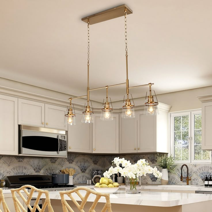 a kitchen with white cabinets and an island that has chairs around it in front of the counter