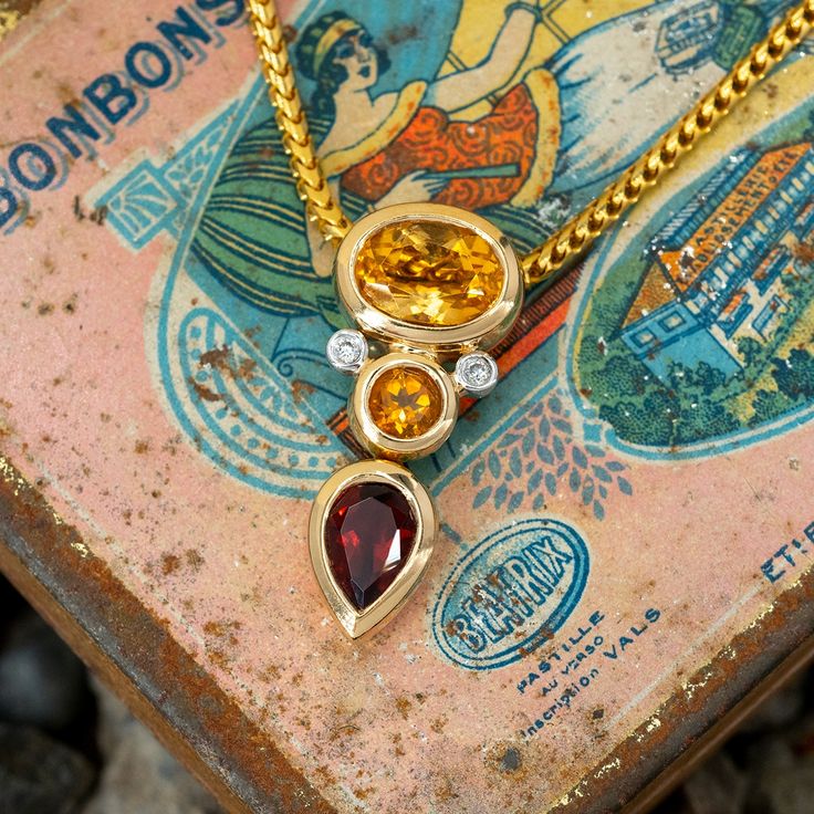 This striking pendant is accented with one (1), bezel set, oval mixed cut natural citrine, one (1), bezel set, round mixed cut natural citrine, one (1), pear mixed cut natural citrine and two (2), bezel set, round brilliant cut diamonds. The pendant measures 24.2mm X 10.4 X 6.2mm and is suspended from a 14K yellow gold neck chain measuring 20 inches in length. Citrine Rings, Gold Neck Chain, Citrine Jewelry, Visit Egypt, Citrine Pendant, Citrine Stone, Citrine Ring, Neck Chain, Ruby Jewelry