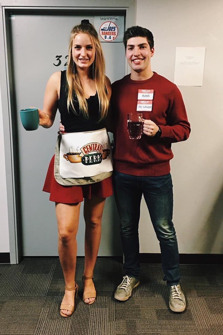 a man and woman standing next to each other in front of a door holding coffee mugs