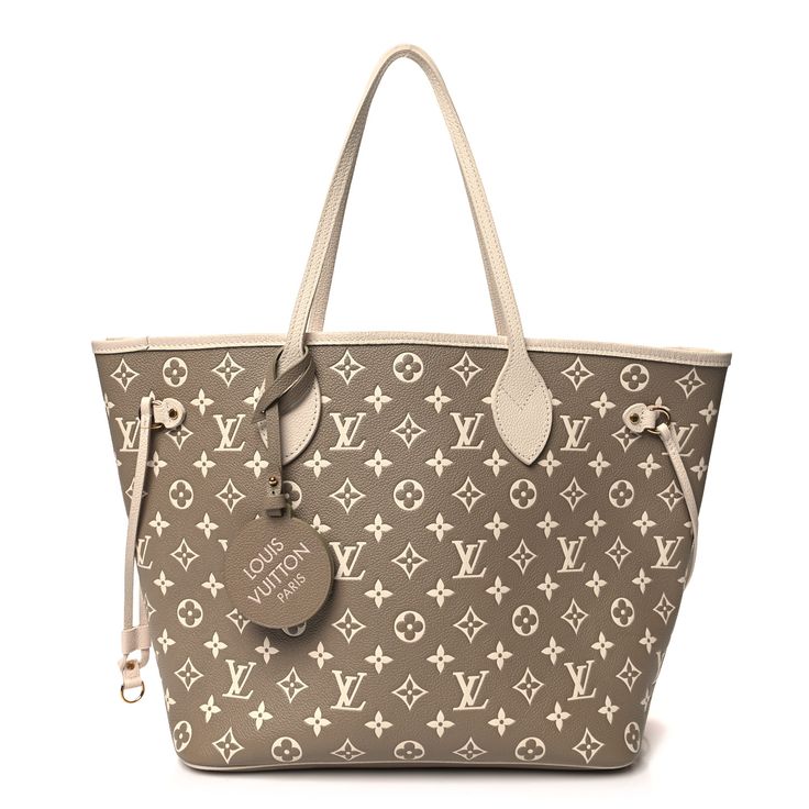 This is an authentic LOUIS VUITTON Empreinte Monogram Spring In The City Neverfull MM in Kaki, Beige, and Cream. This pre-owned luxury tote is part of the Louis Vuitton Spring 2022 “Spring in the City” collection. The tote is crafted of kaki and beige monogram embossed calfskin leather. The bag features leather handles and polished gold-tone hardware with four side laces for cinching. The top is open to a spacious beige microfiber interior with a hanging zipper pocket. Lv Purses And Handbags, Spring In The City, Lv Purse, Louis Vuitton Totes, Louis Vuitton Empreinte, Louis Vuitton Damier Azur, Luxury Purses, Neverfull Mm, Louis Vuitton Damier Ebene