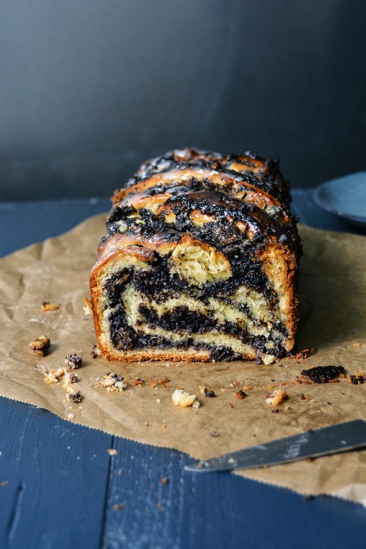 a piece of cake sitting on top of brown paper