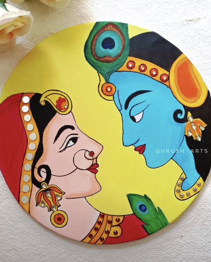 a painted plate with an image of two women facing each other and flowers in the background