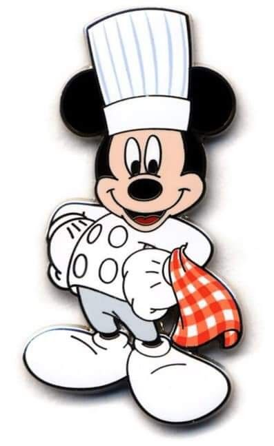 a mickey mouse wearing a chef's hat and holding a red checkered cloth