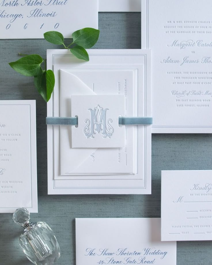 the wedding stationery is laid out on the table