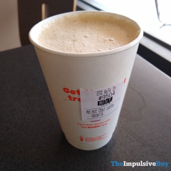 a close up of a cup on a table near a window with the words get free written on it