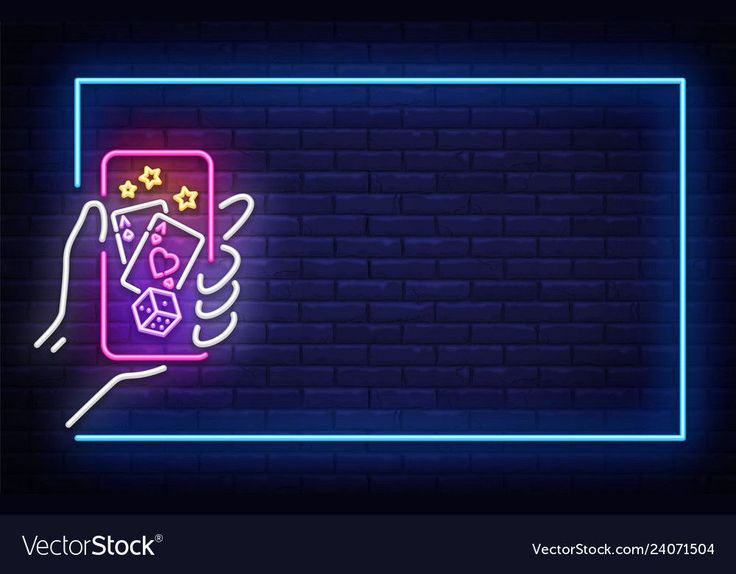 a neon sign with a hand holding a game controller in front of a brick wall