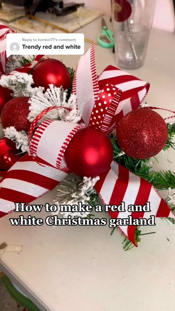 red and white christmas decorations sitting on top of a table