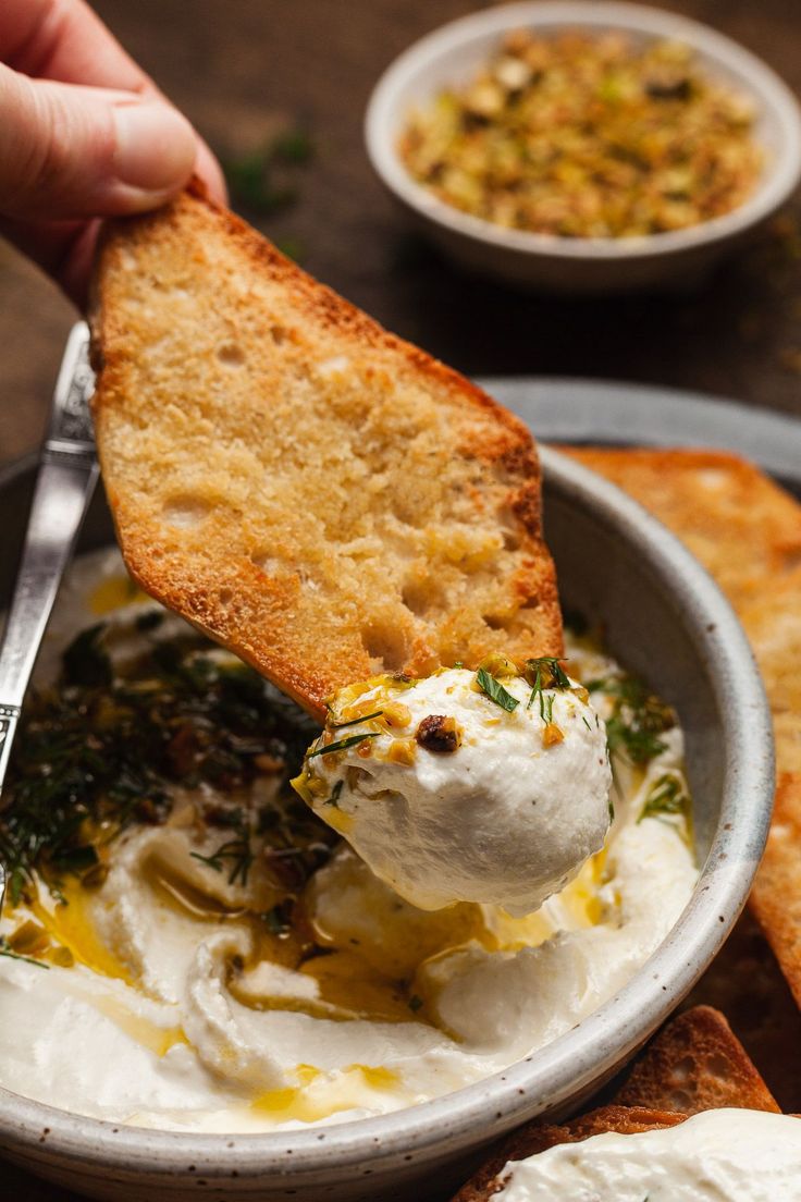 an image of a bowl of whipped feta dip with toasted bread on the side