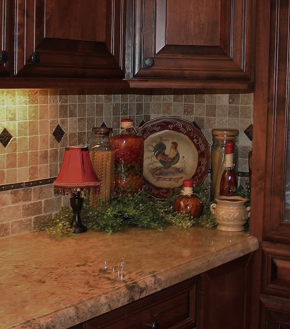 a kitchen counter topped with lots of brown cabinets