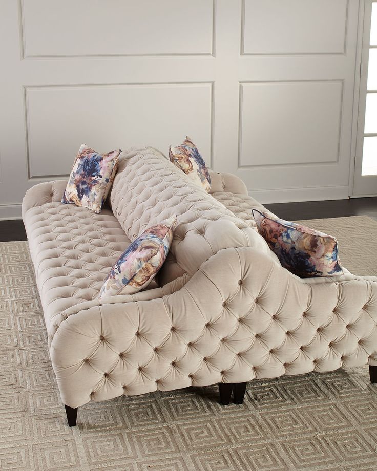 a couch sitting on top of a carpeted floor next to a white closet door