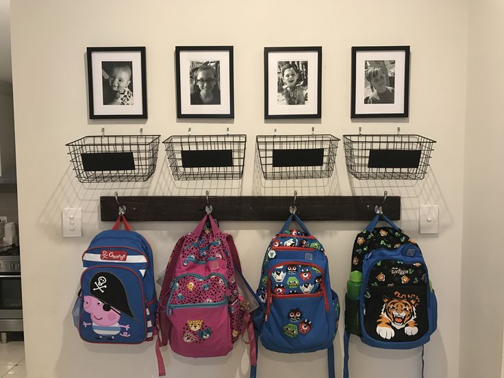 the back to school backpacks are hanging up on the wall with pictures above them