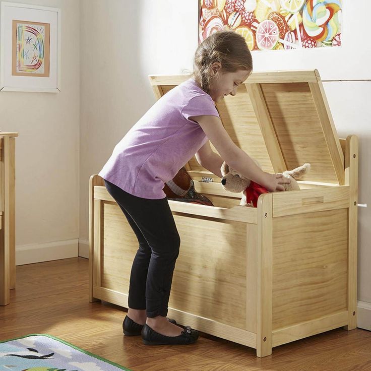 Kids will love having a handy place to store all their toys, and adults will love the classic styling and durability of this wooden toy chest! A finish that's easy to wipe clean and fits with any home dcor, the toy chest features 8.25 cubic feet of storage space and a safety-hinged lid. Easy to assemble with a Philips head screwdriver, not included. What's Included Toy Chest | Melissa & Doug Wooden Toy Chest in Honey | Nebraska Furniture Mart Wooden Toy Chest, Wood Toy Chest, Kids Beds With Storage, Wooden Toy Boxes, Cool Bookshelves, Home Goods Store, Toy Storage Boxes, Kids Wooden Toys, Childrens Furniture