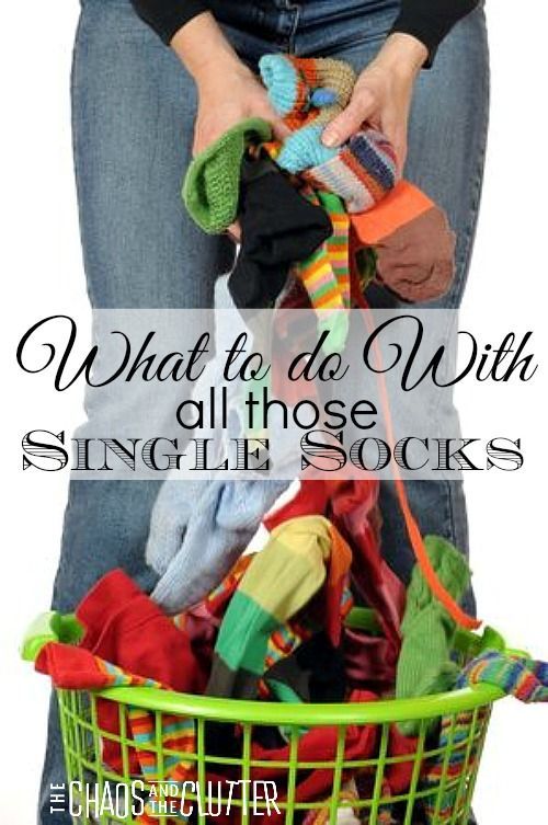 a woman holding a basket full of clothes with the words what to do with all those single socks