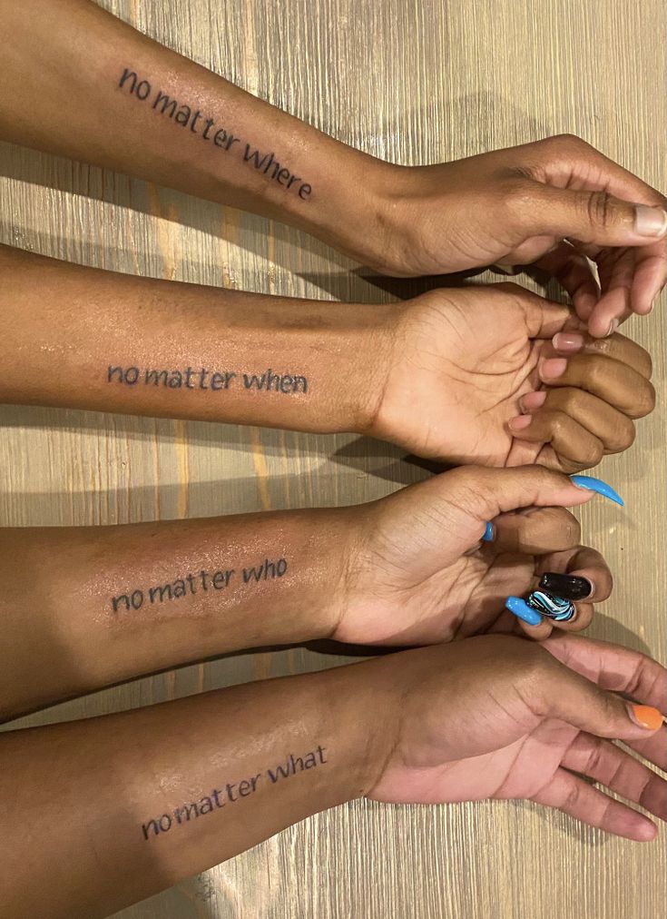 four girls with matching tattoos on their arms and wrist saying no matter who, whatever or what