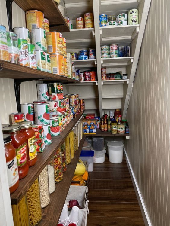 the pantry is stocked with various foods and condiments