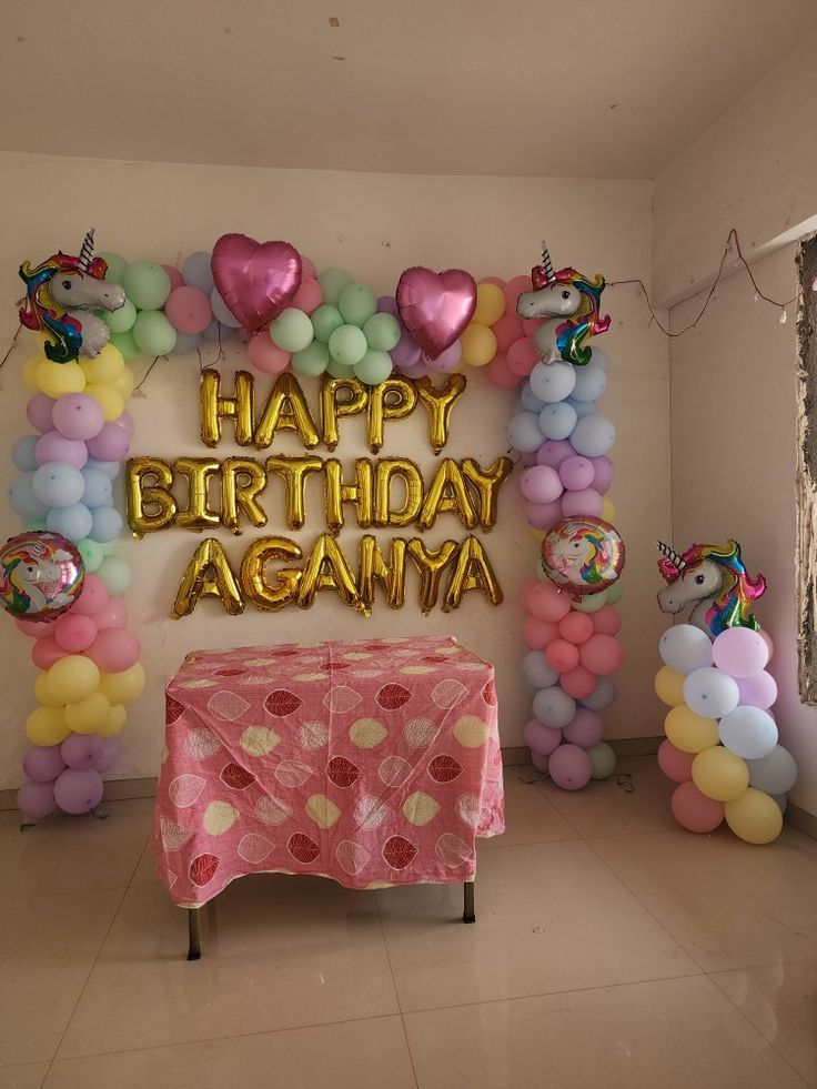 a birthday party with balloons and decorations