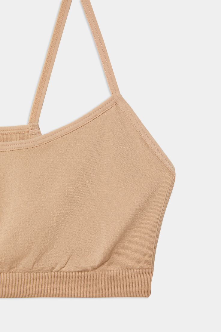 An easy to wear seamless bra designed to go from gym to everyday...seamlessly. Chafe-free fabric lets you move with easy and layers beautifully under any top. BEST FOR: running, yoga, crossfit, barre, pilates, spin class or gym workouts. Model is 5'10" and wears a size XS/S. Beige Stretch Sports Bra With Built-in Bra, Solid Color Sports Bra With Light Support, Light Support Stretch Sports Bra, Versatile Light Support Sports Bra, Basic Stretch Activewear With Built-in Bra, Crop Top With Built-in Bra For Light Exercise, Casual Micro-elastic Sports Bra With Built-in Bra, Fitted Seamless No-show Sports Bra, Cami Sports Bra With Built-in Bra For Gym