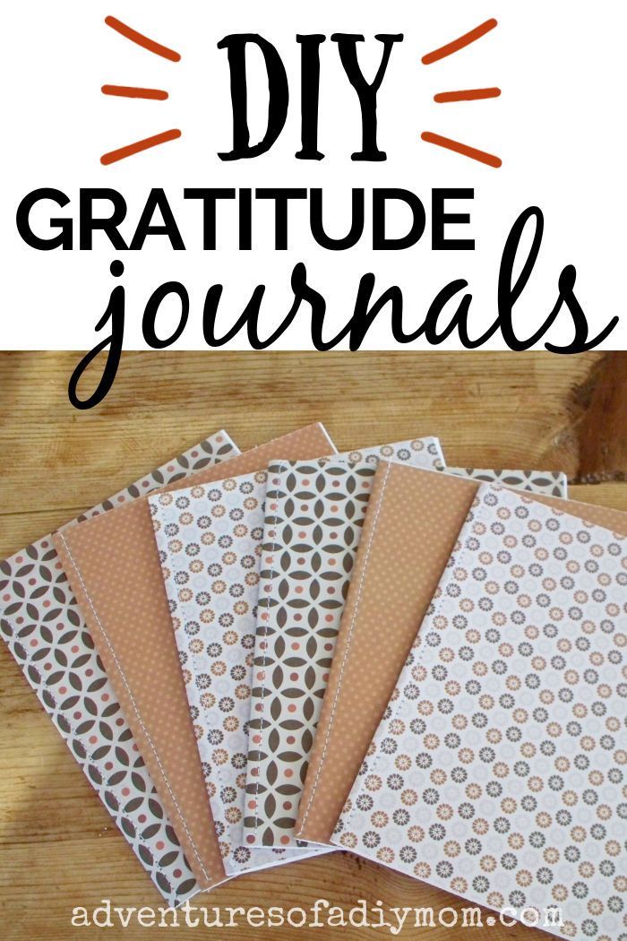 the words diy gratitude journals on top of several papers