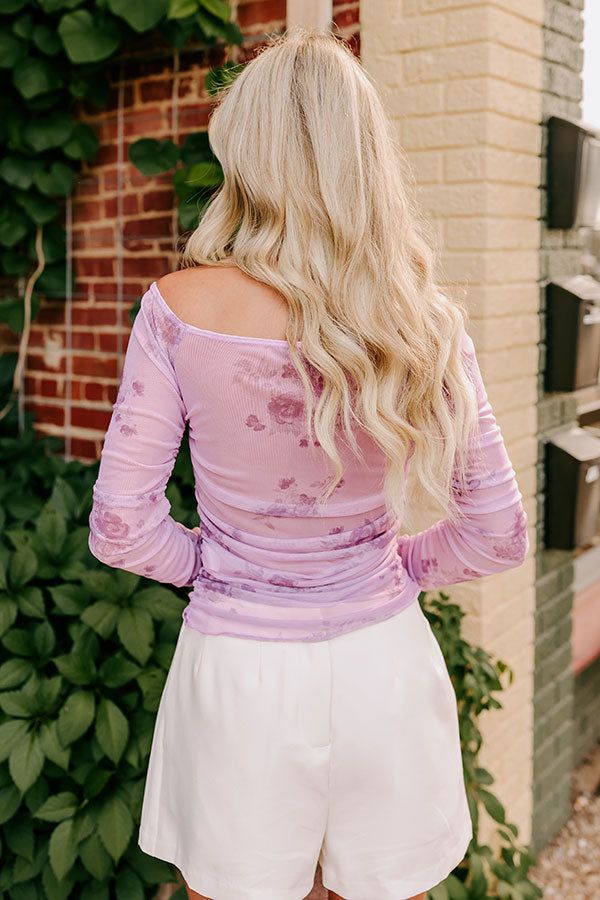 - Turn up the romantic vibes with this sweet mesh top! With a gorgeous floral print, a sheer back, and a flattering silhouette, this piece is perfect for showing your flirty side. Whether you are dressing up for a special date night or simply want to infuse your everyday look with a bit of charm, this mesh top will have you falling head over heels. - Airy mesh material with a purple hued floral print - A built-in lining at the front - An elastic boat cut neckline - Long sleeves with elastic ruch Spring Fitted Mesh Top With Sheer Sleeves, Feminine Purple Top With Floral Print, Feminine Spring Mesh Top, Fitted Feminine Mesh Top For Spring, Fitted Mesh Top For Spring, Spring Tops With Sheer Sleeves, Feminine Sheer Mesh Top For Spring, Sheer Feminine Mesh Top For Spring, Sheer Feminine Top For Spring