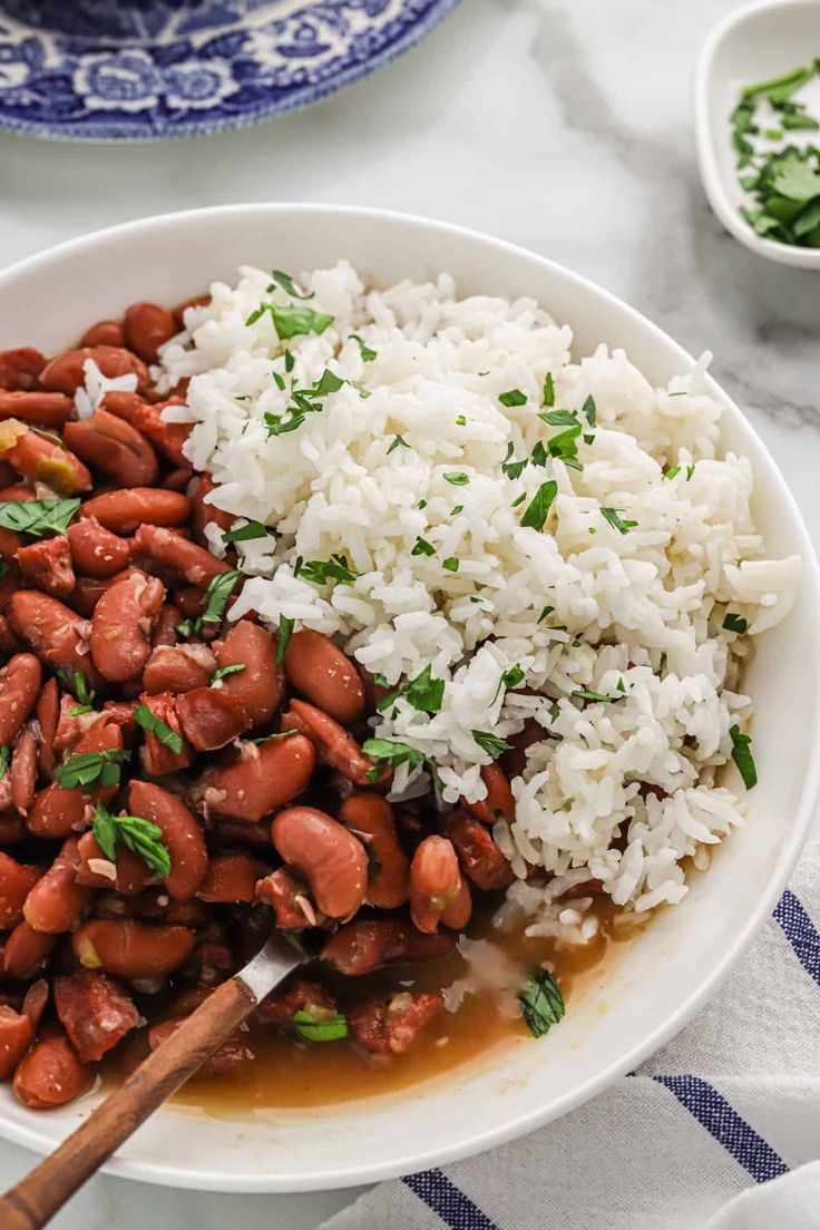 a white bowl filled with rice and beans