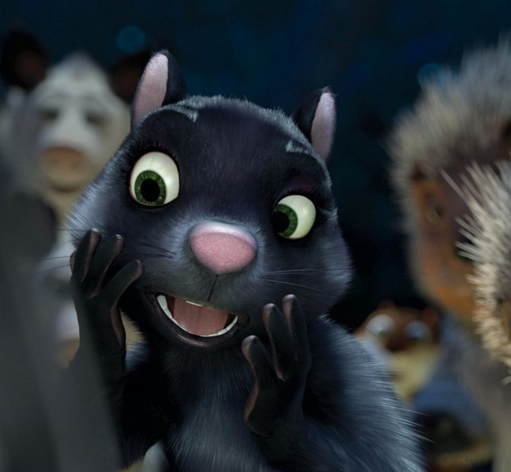 an animated black cat with big green eyes and hands on his face, surrounded by other stuffed animals