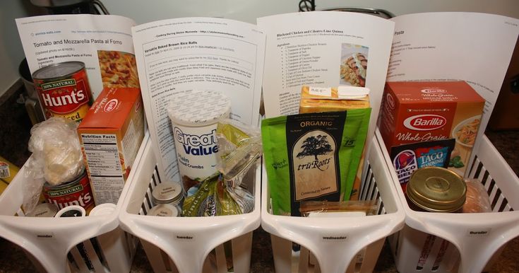 four baskets filled with food sitting on top of a counter