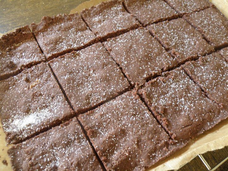 chocolate brownies sitting on top of a metal counter