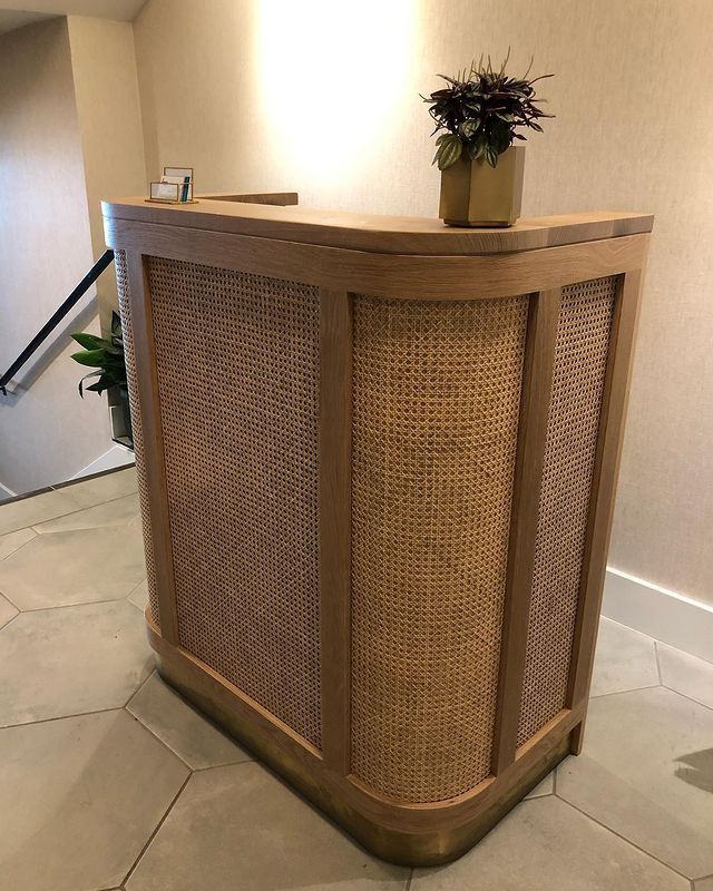 a large wooden counter sitting on top of a tiled floor