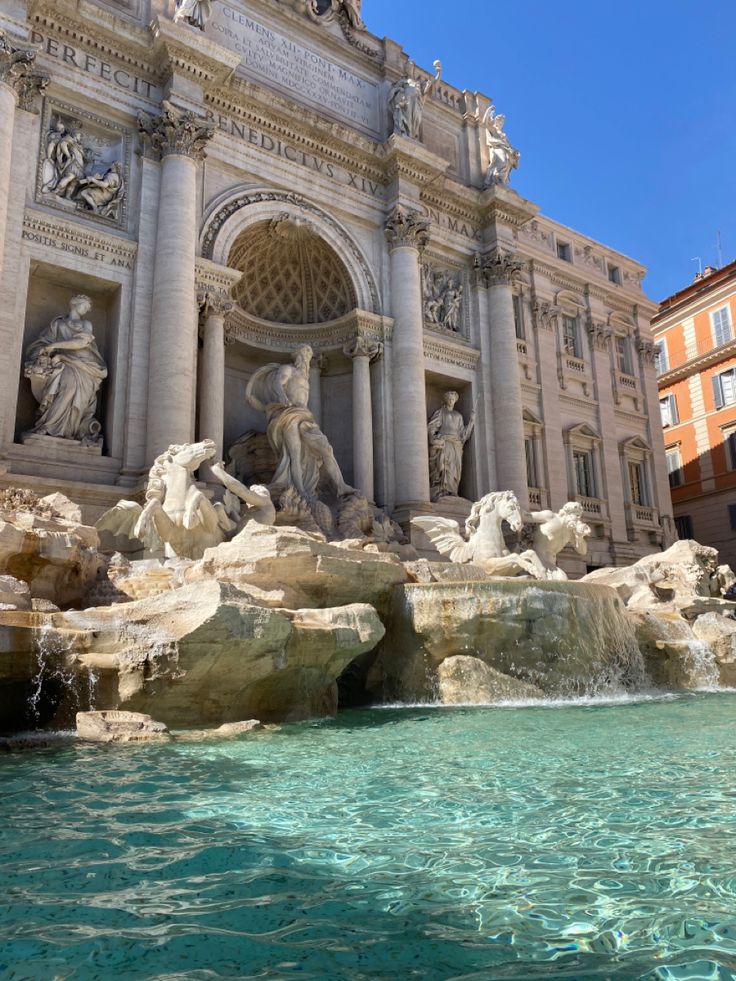 the trellotto fountain is surrounded by statues and water features in front of an ornate building