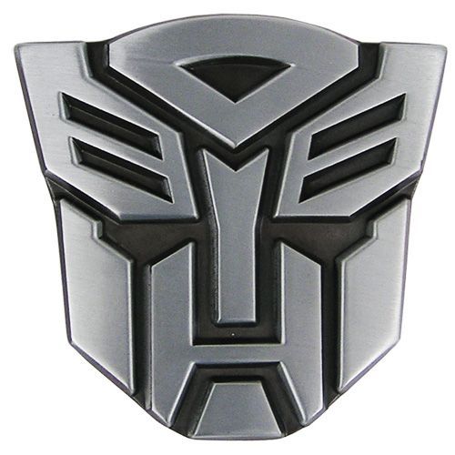 a silver and black badge with the shape of a robot