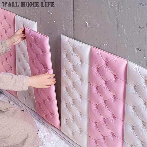 a woman sitting on the floor next to pink and white bedspreads with buttons