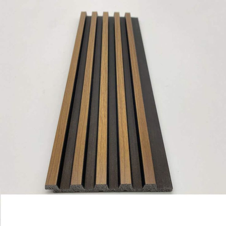 some black and brown wood planks on a white surface