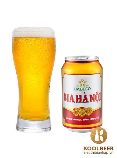 a beer in a glass next to a can of habeco bihano