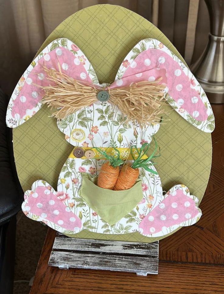 a bunny decoration with carrots in a pot