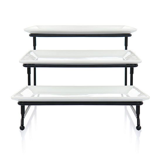 three tiered serving trays with black legs and white plates on each one side