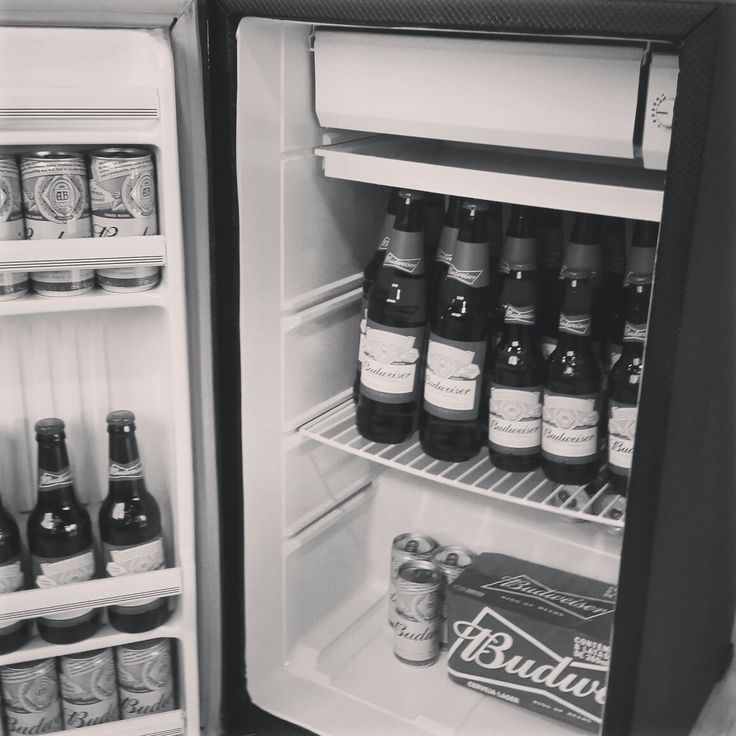 an open refrigerator filled with lots of beer