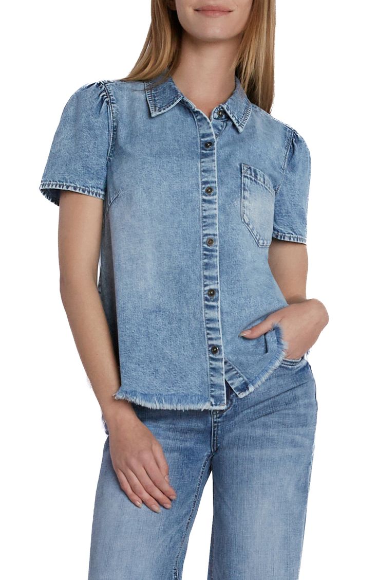 Charming puff sleeves frame this casual-cool denim shirt punctuated with a feathery frayed hem. 24" length Spread collar Short sleeves 100% cotton Machine wash, tumble dry Imported Trendy Denim Top With Frayed Hem, Relaxed Fit Denim Top With Frayed Hem, Relaxed Fit Dark Wash Denim Top With Frayed Hem, Trendy Relaxed Fit Denim Top With Frayed Hem, Button-up Denim Blue Top With Frayed Hem, Relaxed Fit Denim Blue Top With Frayed Hem, Cotton Denim Top With Frayed Hem And Relaxed Fit, Trendy Button-up Top With Frayed Hem, Casual Puff Sleeve Shirt