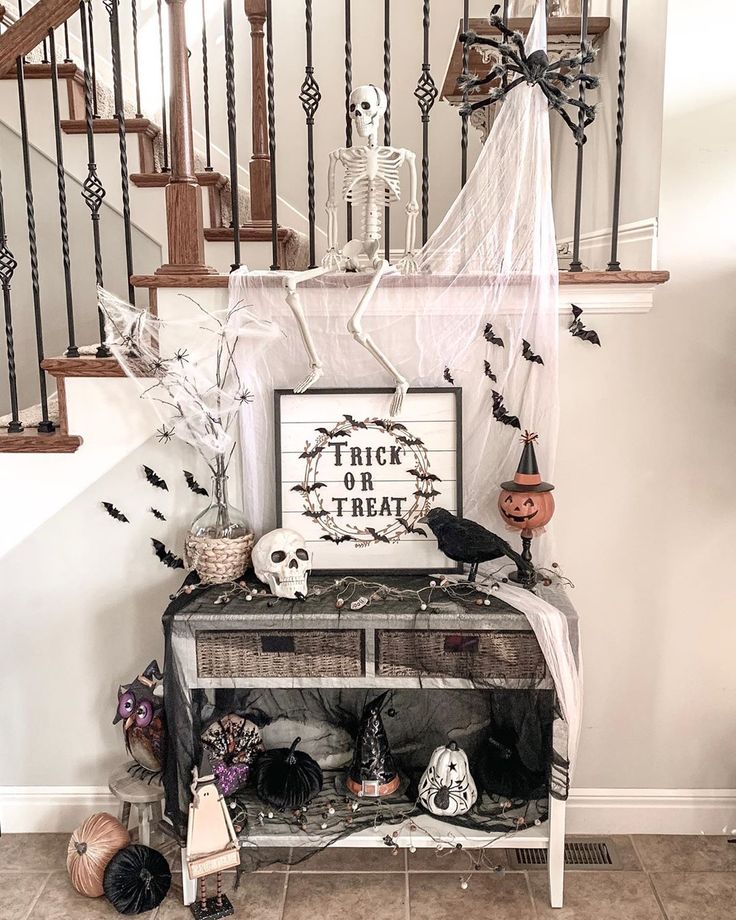 a halloween scene with bats and decorations on the stairs