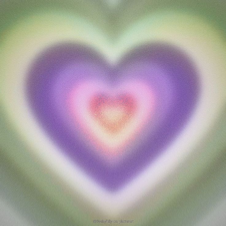 an abstract image of a heart in purple, green and yellow colors with blurry background