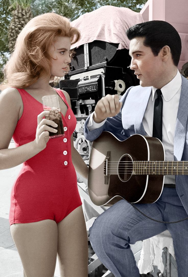 a man and woman in bathing suits are playing the guitar