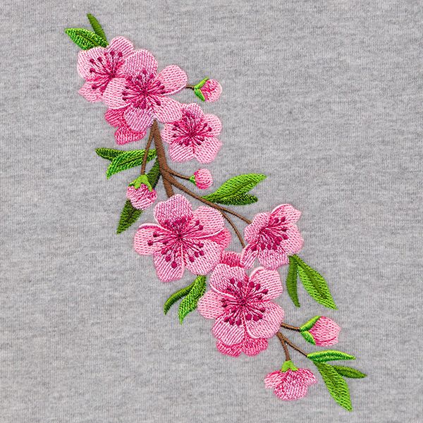 pink flowers are embroidered onto the back of a gray shirt