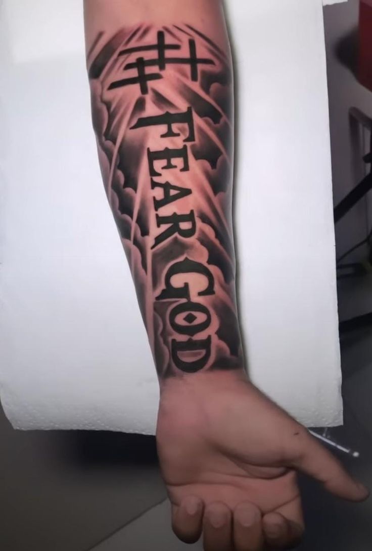 999 Arm Tattoo, Fear God Tattoo Men Bicep, Fear No Man But God Tattoo, The Chosen One Tattoo, Front Arm Tattoo Men, Fear God Tattoo Men, Inside Forearm Tattoo, Inside Arm Tattoo Men, Bicep Tattoo For Guys Inner