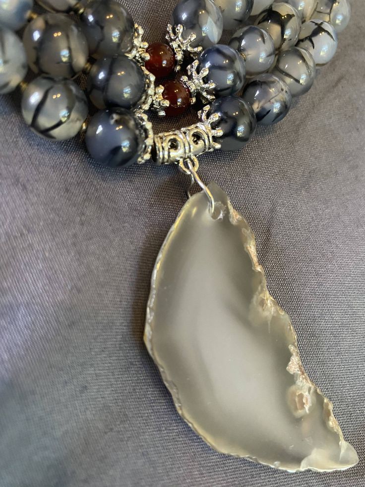 Length: 42.5cm (16.75in)*Necklace “Smokey Dragon” - Black Dragon Vein Agate, Gray Agate, Red Agate, Black Agate, Gray Agate Pendant, Metal Accessories.Намисто “Димчастий дракон”- Чорні жили дракона агат, сірий агат, червоний агат, чорний агат, падвіска з сірого агату, металева фурнітура. Agate- will bring order, harmony in relationships, promotes self-confidence, will help to overcome fear. Also, relieves cramps, and protects against infections. It is recommended to wear white agate for throat d Dragon Black, Overcome Fear, Dragon Vein Agate, Grey Agate, Dragon Necklace, White Agate, Black Dragon, Metal Accessories, Red Agate