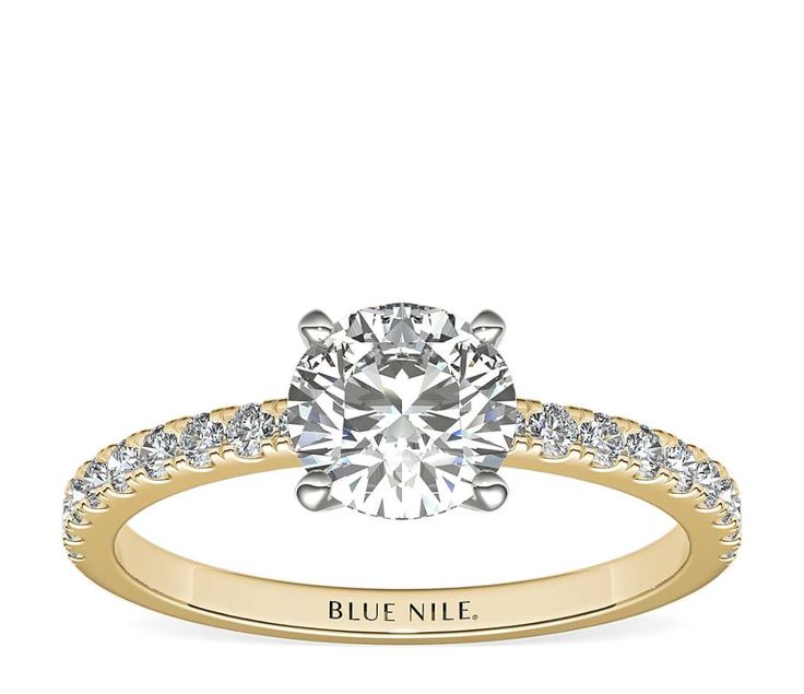 a white gold engagement ring with diamonds on it