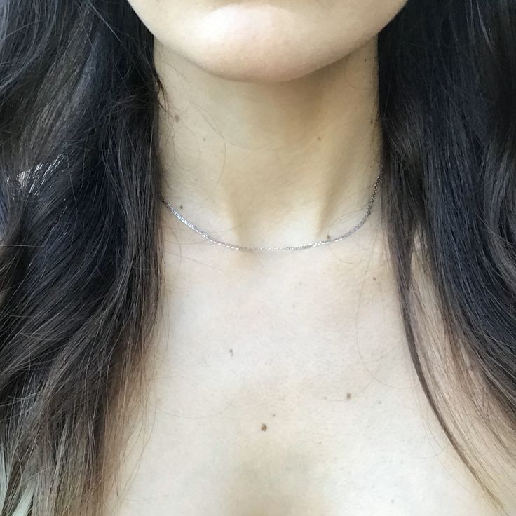 This necklace is a simple and elegant 14k solid white gold, 1.5mm anchor choker. It is great to wear alone as a classy piece or layer with other necklaces. How to Measure One's Neck for a Choker Necklace: https://youtu.be/z6XBly02mtY This item is made of recycled material. I suggest measuring around your neck with a string or tape measure to see if this necklace will fit you as desired. Custom sized necklaces can be made and a solid extension chain can also be added, please message me to inquire Minimalist Diamond Cut Chain Necklace As Gift, Delicate Everyday White Gold Chain Necklace, Minimalist White Gold Clavicle Chain Necklace, Dainty Silver Choker With Delicate Chain, Dainty Sterling Silver Choker With Delicate Chain, Minimalist Sterling Silver Choker With Delicate Chain, Dainty Sterling Silver Diamond Cut Chain Necklace, Minimalist Sterling Silver Choker Chain Necklace, Dainty Diamond Cut Sterling Silver Chain Necklace